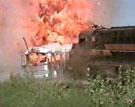 Adam's bus is destroyed by the oncoming train.