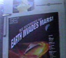 Poster on fridge: 'This Independence Day: Earth Invades Mars!'